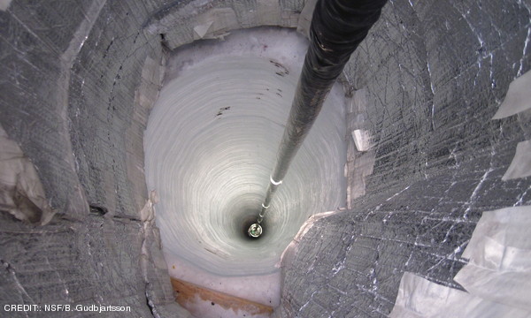A sensor descends down a hole in the ice as part of the final season of IceCube. CREDIT: NSF/B. Gudbjartsson June 2011 Extra
