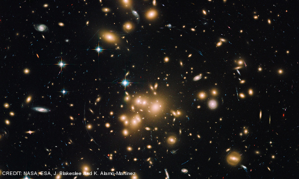 Hubble Wide-Field Image of Galaxy Cluster and Gravitational Lens Abell 1689 CREDIT: NASA, ESA, J. Blakeslee and K. Alamo-Martinez October 2013