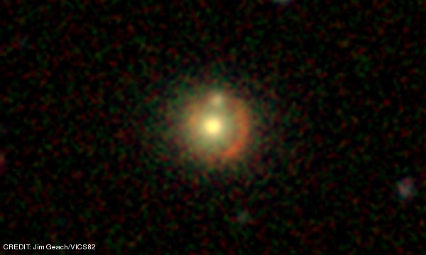 The first gravitational lens to be discovered by citizen science, identified as part of the Zooniverse SpaceWarps project during BBC Stargazing Live in January 2014. CREDIT: Jim Geach/VICS82 August 2014 Extra