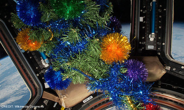 The International Space Station's Cupola module decorated for the Christmas holidays. CREDIT: Wikimedia Commons December 2016 Extra