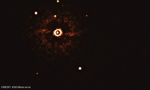This image, captured by the SPHERE instrument on ESO’s Very Large Telescope, shows the star TYC 8998-760-1 accompanied by two giant exoplanets, TYC 8998-760-1b and TYC 8998-760-1c. This is the first time astronomers have directly observed more than one planet orbiting a star similar to the Sun. CREDIT: ESO/Bohn et al. September 2020